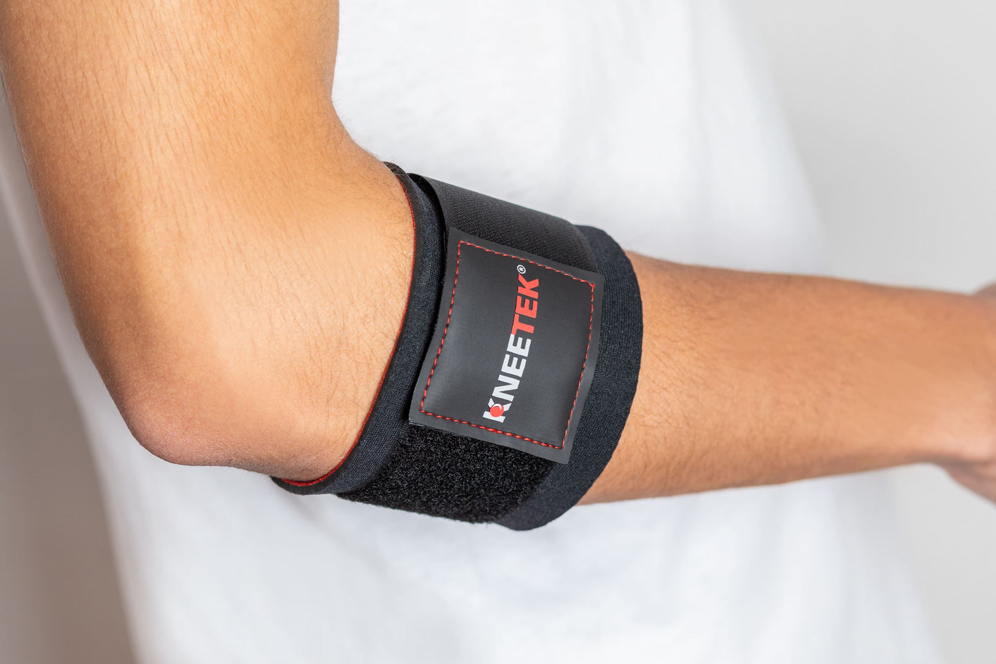 KNEETEK Unterarmbandage für den linken Arm | Größe: S/M | selbstwärmende Unterarmstütze | elastische Bandage für den Unterarm zur Kompression und Führung für die Sehnen